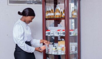 A picture of a Lady holding Firstgrade Chemicals